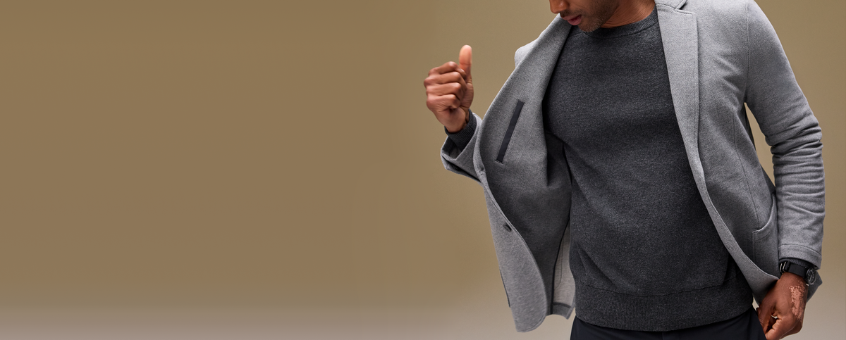 Guy holding open his ACE Blazer to show inside pocket