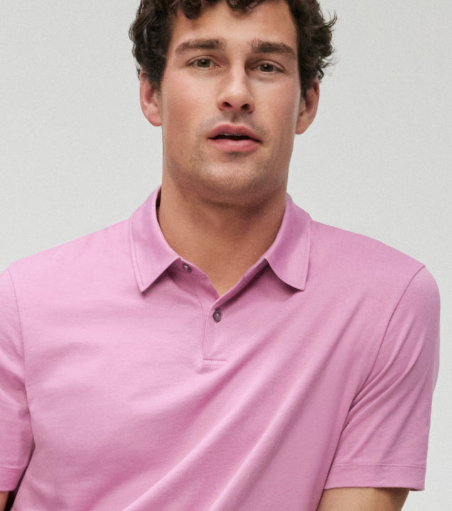 profile image of a man wearing a pink polo