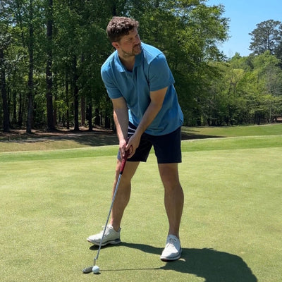 Man playing golf wearing Heavyweight Slub polo