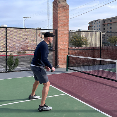 man playing tennis wearing Mack Weldon clothing