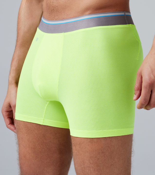 image of a man wearing neon green AIRKNITx boxer briefs