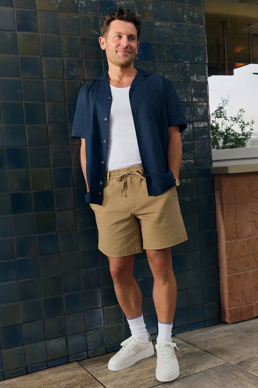 Man wearing Linen Camp Shirt, Pima Tank, and Stretch Twill Chino Drawstrings Shorts