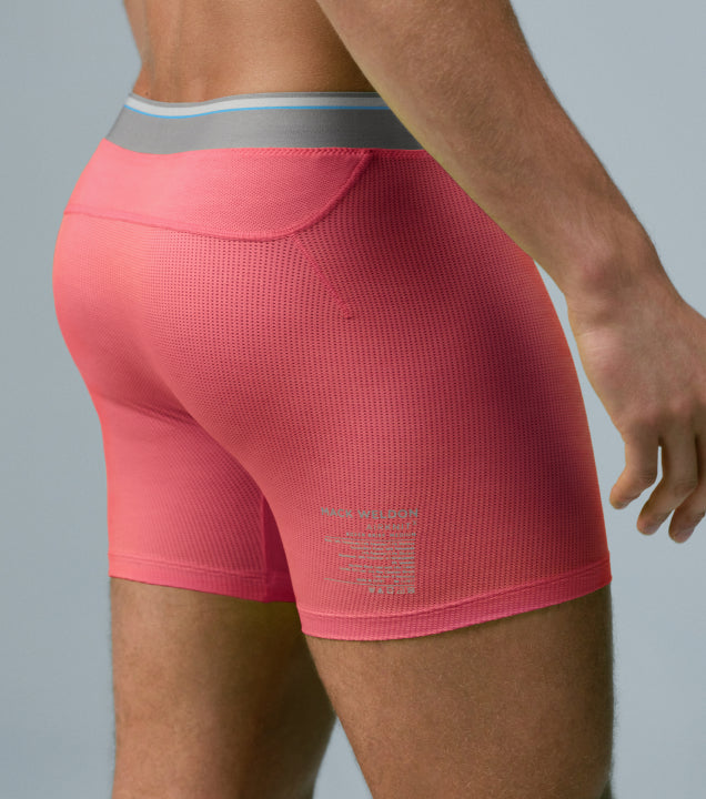 image of a man wearing neon red AIRKNITx boxer briefs