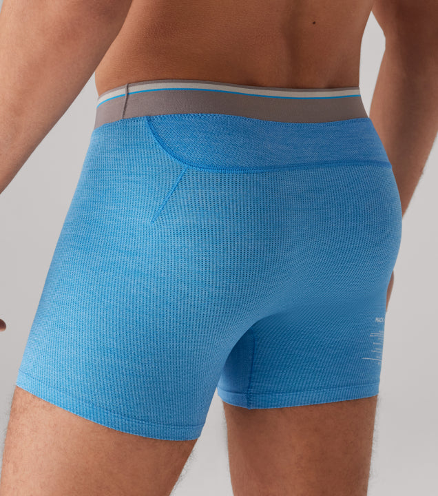 image of a man wearing bright blue AIRKNITx boxer briefs