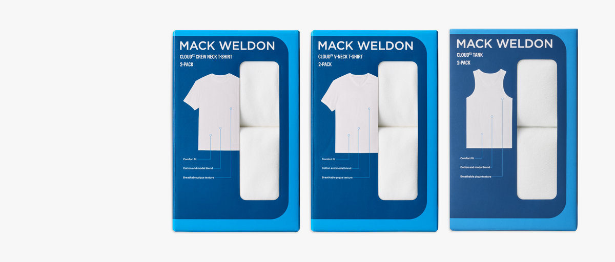 Three blue 2-pack boxes of Mack Weldon undershirts